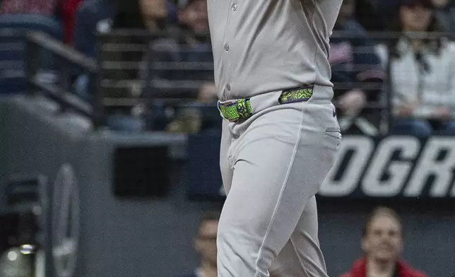 New York Yankees' Jasson Dominguez celebrates after his two-run home run off Cleveland Guardians starting pitcher Gavin Williams during the seventh inning of a baseball game in Cleveland, Monday, April 21, 2025. (AP Photo/Phil Long)