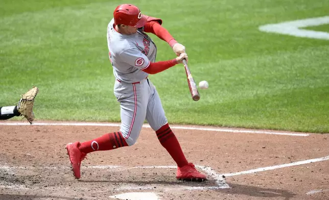 Cincinnati Reds' Austin Hays hits a RBI double during the fifth inning of a baseball game against the Baltimore Orioles, Sunday, April 20, 2025, in Baltimore. (AP Photo/Nick Wass)