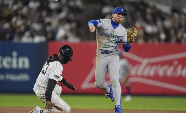 Kansas City Royals' Bobby Witt Jr. (7) throws out New York Yankees' Austin Wells at first base after forcing out Jazz Chisholm Jr. (13) for a double play during the seventh inning of a baseball game Wednesday, April 16, 2025, in New York. (AP Photo/Frank Franklin II)
