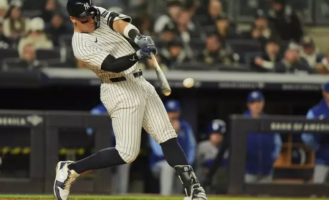 New York Yankees' Aaron Judge hits a double during the third inning of a baseball game against the Kansas City Royals Wednesday, April 16, 2025, in New York. (AP Photo/Frank Franklin II)