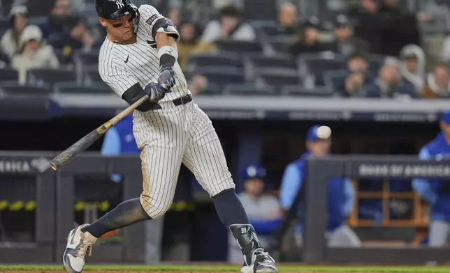 New York Yankees' Aaron Judge hits a home run during the seventh inning of a baseball game against the Kansas City Royals Wednesday, April 16, 2025, in New York. (AP Photo/Frank Franklin II)
