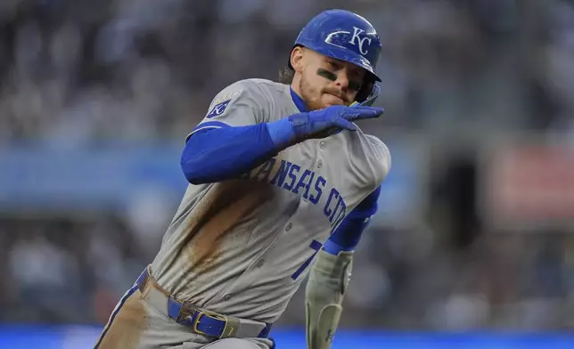 Kansas City Royals' Bobby Witt Jr. turns toward home plate to score on an RBI single by Salvador Perez during the first inning of a baseball game against the New York Yankees Wednesday, April 16, 2025, in New York. (AP Photo/Frank Franklin II)