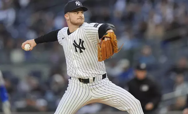 New York Yankees' Clarke Schmidt pitches during the first inning of a baseball game against the Kansas City Royals Wednesday, April 16, 2025, in New York. (AP Photo/Frank Franklin II)