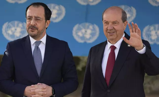 Cyprus' President Nikos Christodoulides, left, and Turkish Cypriot leader Ersin Tatar pose before their meeting with the U.N. Secretary General's Special Representative in Cyprus Colin Stewart, at a U.N compound inside the U.N controlled buffer zone at abandoned Nicosia airport in divided capital Nicosia, Cyprus, Wednesday, April 2, 2025. (AP Photo/Petros Karadjias)