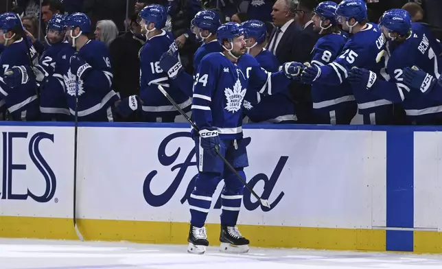 Toronto Maple Leafs' Auston Matthews (34) celebrates his goal against the Detroit Red Wings during the first period of their NHL hockey game Thursday, April 17, 2025 in Toronto. (Jon Blacker/The Canadian Press via AP)