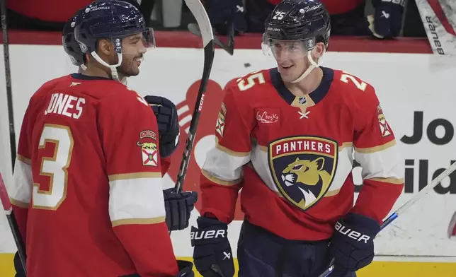 Florida Panthers right wing Mackie Samoskevich (25) celebrates a goal during the second period of an NHL hockey game against the Detroit Red Wings, Thursday, April 10, 2025, in Sunrise, Fla. (AP Photo/Marta Lavandier)