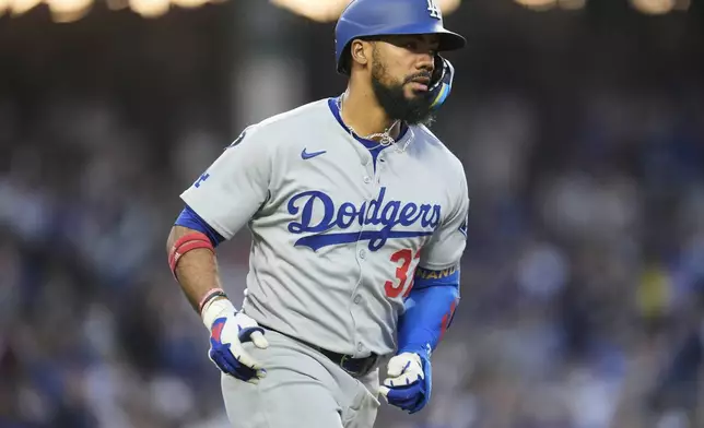 Los Angeles Dodgers right fielder Teoscar Hernández (37) runs the bases after hitting a two-run home run during the fifth inning of a baseball game against the Chicago Cubs, Wednesday, April 23, 2025, in Chicago. (AP Photo/Erin Hooley)