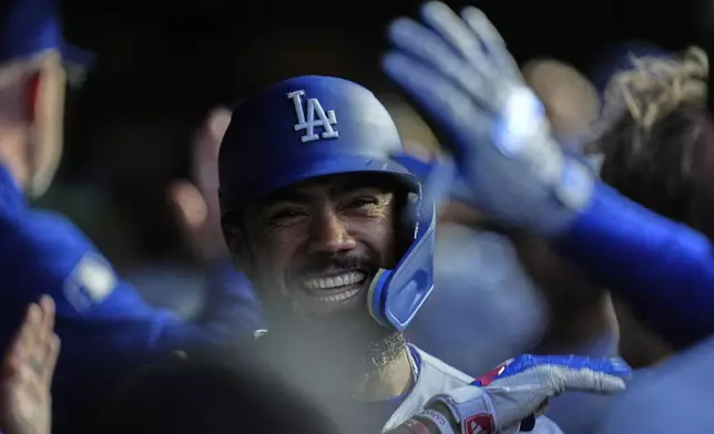 Los Angeles Dodgers right fielder Teoscar Hernández (37) celebrates after hitting a two-run home run during the fifth inning of a baseball game against the Chicago Cubs, Wednesday, April 23, 2025, in Chicago. (AP Photo/Erin Hooley)
