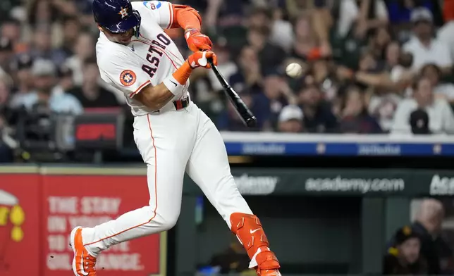 Houston Astros' Cam Smith (11) singles against San Diego Padres starting pitcher Dylan Cease during the fifth inning of a baseball game Sunday, April 20, 2025, in Houston. (AP Photo/Karen Warren)