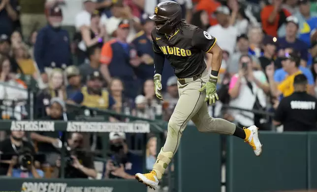 San Diego Padres' Fernando Tatis Jr. reacts after his home run against Houston Astros relief pitcher Tayler Scott during the seventh inning of a baseball game Sunday, April 20, 2025, in Houston. (AP Photo/Karen Warren)