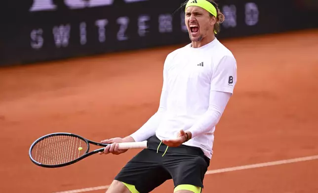 Germany's Alexander Zverev celebrates after winning against Netherlands' Tallon Griekspoor in a men's singles quarterfinal match at the Munich tennis tournament, in Munich, Germany, Friday April 18, 2025. (Sven Hoppe/dpa via AP)