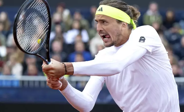 Germany's Alexander Zverev returns a ball to Netherlands' Tallon Griekspoor, during the men's singles quarterfinal match at the Munich tennis tournament, in Munich, Germany, Friday April 18, 2025. (Sven Hoppe/dpa via AP)