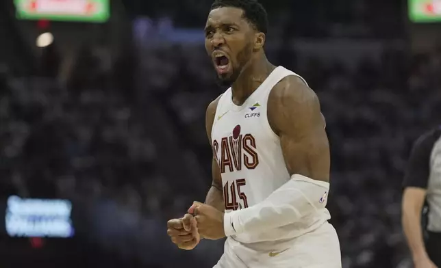 Cleveland Cavaliers guard Donovan Mitchell (45) reacts in the first half half in Game 1 of an NBA first-round playoff series against the Miami Heat, Sunday, April 20, 2025, in Cleveland. (AP Photo/Sue Ogrocki)
