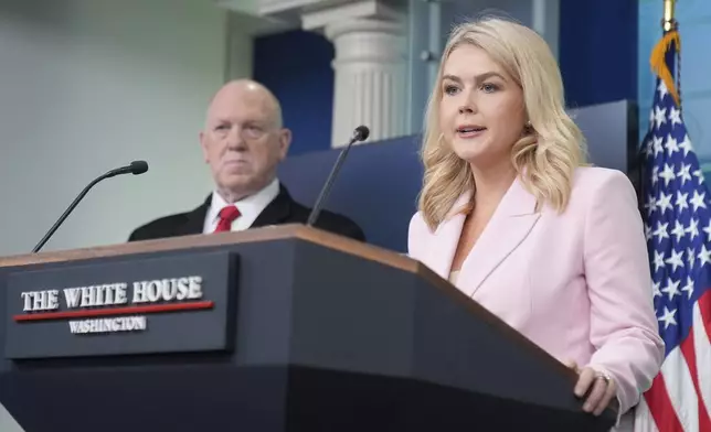 White House press secretary Karoline Leavitt, with White House border czar Tom Homan, speaks with reporters in the James Brady Press Briefing Room at the White House, Monday, April 28, 2025, in Washington. (AP Photo/Mark Schiefelbein)