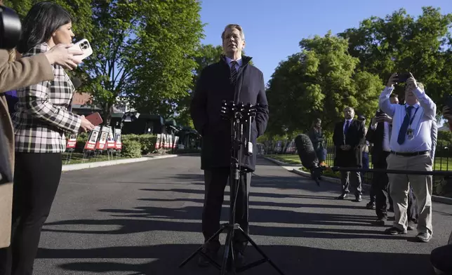 Treasury Secretary Scott Bessent speaks with reporters outside the White House, Monday, April 28, 2025, in Washington. (AP Photo/Mark Schiefelbein)