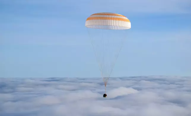 The Soyuz MS-26 spacecraft is seen as it lands in a remote area near the town of Zhezkazgan, Kazakhstan, with NASA astronaut Don Pettit and Roscosmos cosmonauts Alexey Ovchinin and Ivan Vagner aboard, Sunday, April 20, 2025. (Bill Ingalls/NASA via AP)