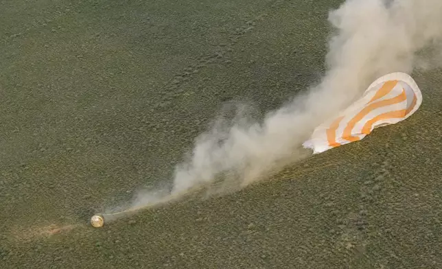 The Soyuz MS-26 spacecraft lands in a remote area near the town of Zhezkazgan, Kazakhstan, with NASA astronaut Don Pettit and Roscosmos cosmonauts Alexey Ovchinin and Ivan Vagner aboard, Sunday, April 20, 2025. (Bill Ingalls/NASA via AP)