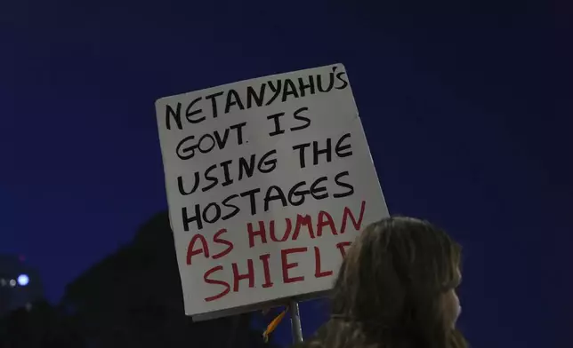 People take part in a protest demanding the immediate release of hostages held by Hamas in the Gaza Strip, in Tel Aviv, Israel, on Saturday, April 19, 2025. (AP Photo/Ariel Schalit)