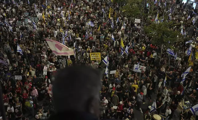 People take part in a protest demanding the immediate release of hostages held by Hamas in the Gaza Strip, in Tel Aviv, Israel, on Saturday, April 19, 2025. (AP Photo/Ariel Schalit)