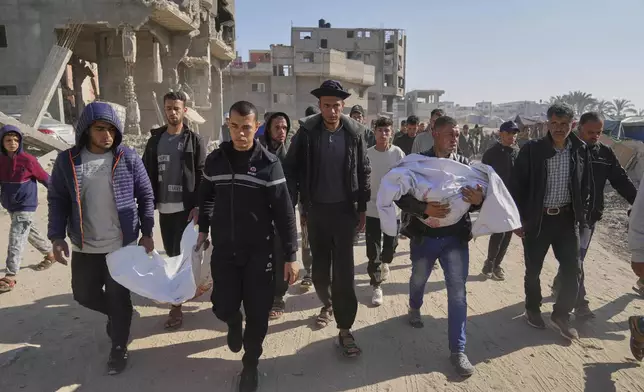 Palestinians carry the bodies of their relatives killed in an Israeli army airstrike, during their funeral in Khan Younis, southern Gaza Strip, Saturday, April 19, 2025. (AP Photo/Abdel Kareem Hana)