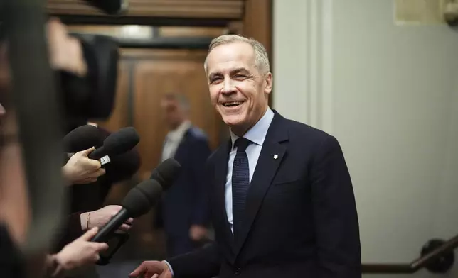 FILE - Canada Liberal Leader Mark Carney talks to the media as he leaves the prime minister's office and makes his way to a caucus meeting in Ottawa on March 10, 2025. (Sean Kilpatrick/The Canadian Press via AP, File)