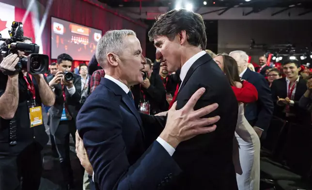 FILE - Mark Carney, Leader of the Liberal Party of Canada, embraces Prime Minister Justin Trudeau after being announced the winner at the Liberal Leadership Event in Ottawa, Ontario, March 9, 2025. (Justin Tang/The Canadian Press via AP, File)