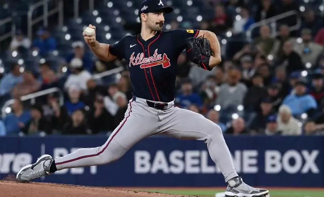 Atlanta Braves starting pitcher Spencer Strider (99) throws to a Toronto Blue Jays batter in the first inning of an interleague baseball game in Toronto, Wednesday, April 16, 2025. (Jon Blacker/The Canadian Press via AP)