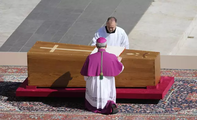Archbishop Diego Giovanni Ravelli, front, presides over the funeral of Pope Francis in St. Peter's Square at the Vatican, Saturday, April 26, 2025. (AP Photo/Markus Schreiber)