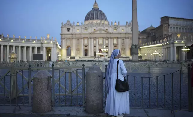 A nun stands in St. Peter's Square ahead of the funeral of Pope Francis at the Vatican, Saturday, April 26, 2025. (AP Photo/Emilio Morenatti)