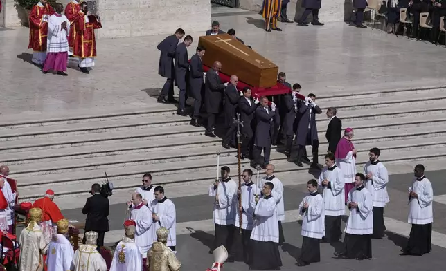 The coffin of Pope Francis is carried into St Peter's Square for his funeral, at the Vatican, Saturday, April 26, 2025. (AP Photo/Gregorio Borgia)