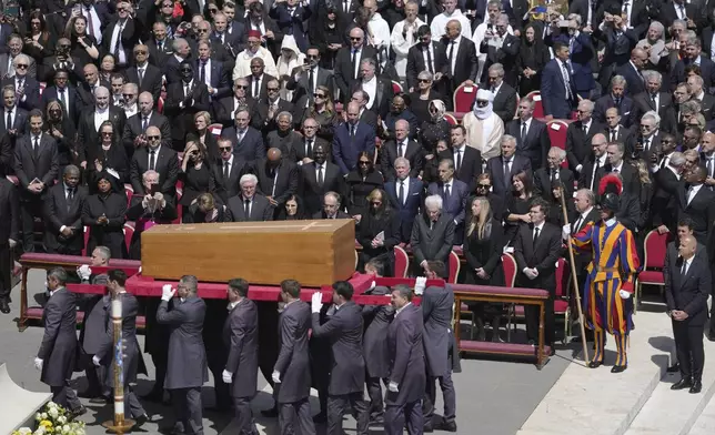 Pallbearers carry the coffin during the funeral of Pope Francis in St. Peter's Square at the Vatican, Saturday, April 26, 2025. (AP Photo/Markus Schreiber)