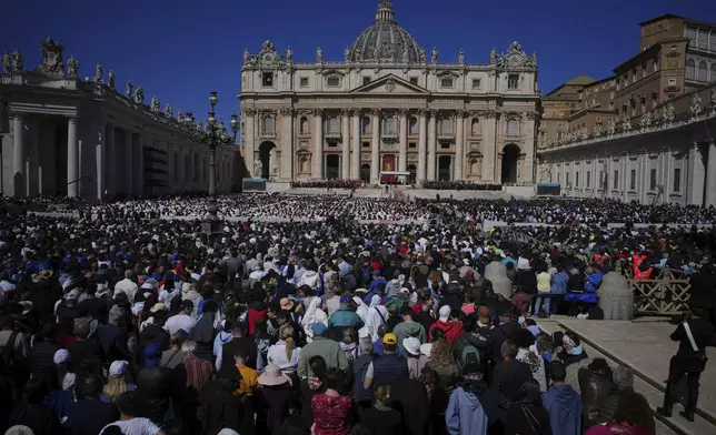 Faithful gather during the funeral of Pope Francis in St. Peter's Square at the Vatican, Saturday, April 26, 2025. (AP Photo/Emilio Morenatti)