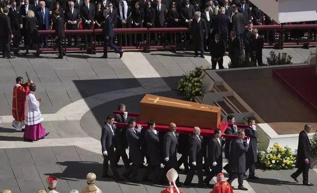 The coffin of Pope Francis is carried into St Peter's Square for his funeral, at the Vatican, Saturday, April 26, 2025. (AP Photo/Evan Vucci)