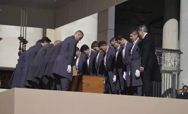 The coffin of Pope Francis is laid into St. Peter's Square during his funeral ceremony, at the Vatican, Saturday, April 26, 2025. (AP Photo/Alessandra Tarantino)