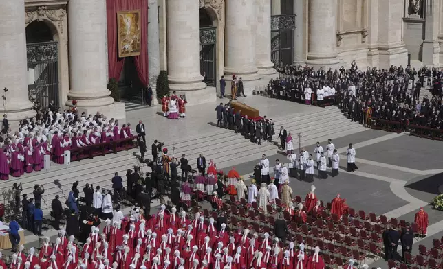 Pallbearers carry the coffin during the funeral of Pope Francis in St. Peter's Square at the Vatican, Saturday, April 26, 2025. (AP Photo/Markus Schreiber)