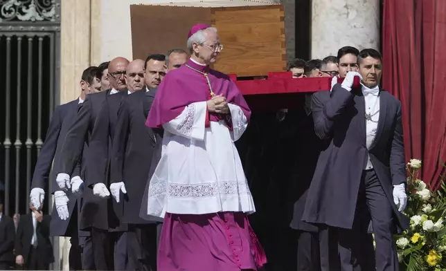 The coffin of Pope Francis is carried into St. Peter's Square during his funeral ceremony, at the Vatican, Saturday, April 26, 2025. (AP Photo/Alessandra Tarantino)
