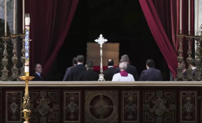 The coffin of Pope Francis is carried back inside St Peter's Basilica at the end of his funeral in St Peter's Square, at the Vatican, Saturday, April 26, 2025. (AP Photo/Andrew Medichini)