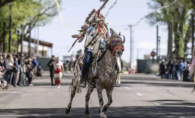 FILE - Shane Redhawk who is Sicangu Lakota leads a horse parade at the 40th anniversary of the Gathering of Nations Pow Wow in Albuquerque, N.M., Friday, April 28, 2023. (AP Photo/Roberto E. Rosales, File)