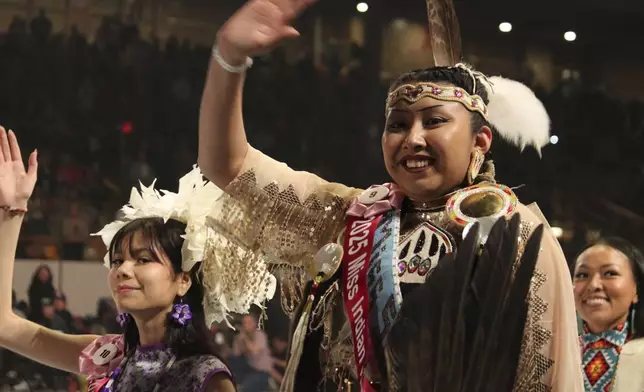 2025 Miss Indian World contestants join the grand entry procession during the annual Gathering of Nations powwow in Albuquerque, New Mexico, Friday, May 25, 2025 .(AP Photo/Susan Montoya Bryan)