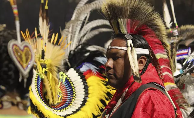 A dancer takes part in the grand entry during the annual Gathering of Nations powwow in Albuquerque, New Mexico, Friday, May 25, 2025. (AP Photo/Susan Montoya Bryan)