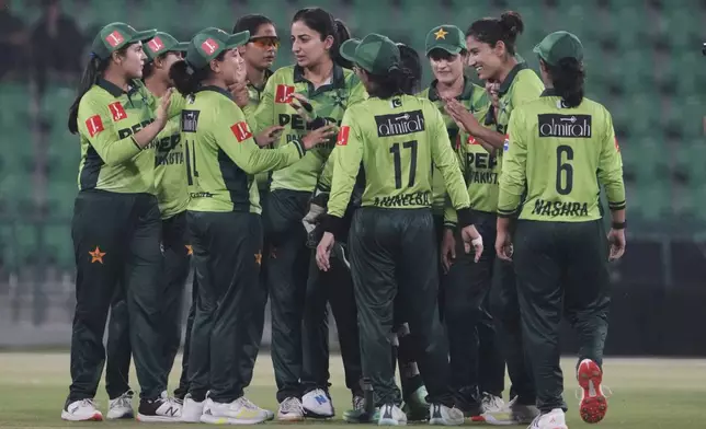 Pakistani players celebrate their win at the ICC Women's World Cup Qualifier match against Thailand in the Gaddafi Stadium, in Lahore, Pakistan, Thursday, April 17, 2025. (AP Photo/K.M. Chaudary)