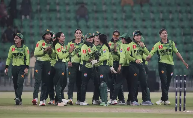 Pakistani players celebrate their win at the ICC Women's World Cup Qualifier match against Thailand in the Gaddafi Stadium, in Lahore, Pakistan, Thursday, April 17, 2025. (AP Photo/K.M. Chaudary)