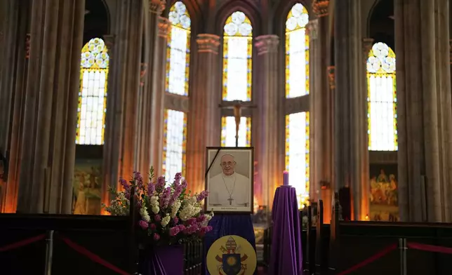 A photograph of Pope Francis is placed at Saint Anthony Catholic church in Istanbul, Turkey, Monday, April 21, 2025. (AP Photo/Khalil Hamra)