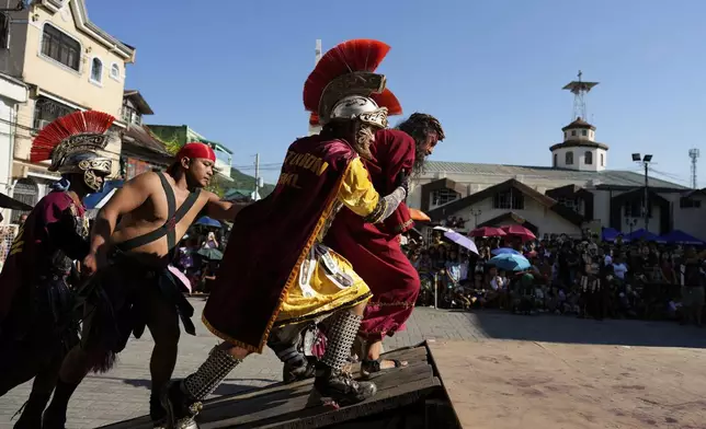 Performer reenact the crucifixion of Jesus Christ to mark Maundy Thursday in Paete town, Laguna province, Philippines, April 17, 2025. (AP Photo/Aaron Favila)