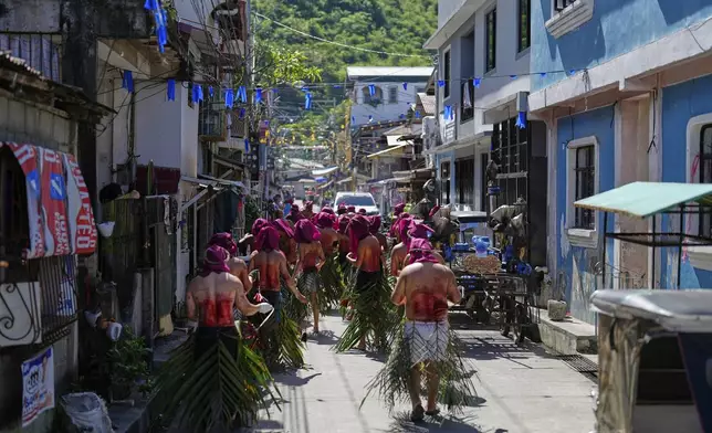 Penitents walk around town flagellating themselves on Good Friday in Kalayaan town, Laguna province, Philippines, April 18, 2025. (AP Photo/Aaron Favila)