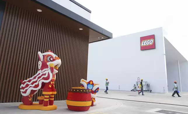 Workers leave work at Lego factory in Binh Duong, Vietnam Wednesday, April 2, 2025. (AP Photo/Hau Dinh)