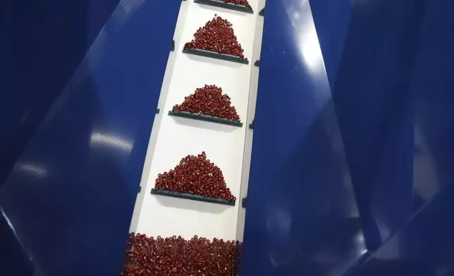 Lego pieces are moved in packing machine at Lego factory in Binh Duong, Vietnam Wednesday, April 2, 2025. (AP Photo/Hau Dinh)
