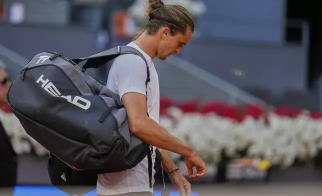 Alexander Zverev of Germany leaves the court after losing to Juan Manuel Cerundolo of Argentina during the Madrid Open tennis tournament in Madrid, Spain, Tuesday, April 29, 2025. (AP Photo/Manu Fernandez)