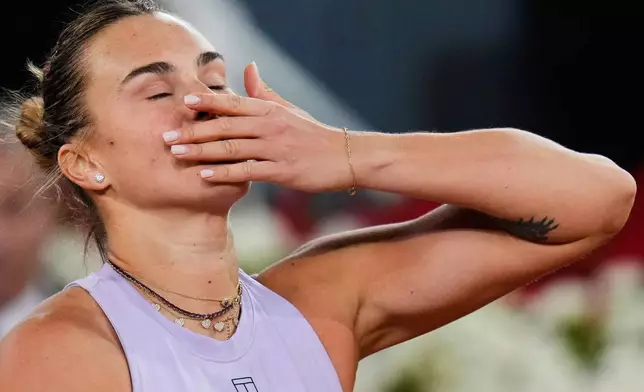 Aryna Sabalenka of Belarus, blows a kiss after defeating United States' Peyton Stearns during the Madrid Open tennis tournament in Madrid, Spain, Tuesday, April 29, 2025. (AP Photo/Manu Fernandez)