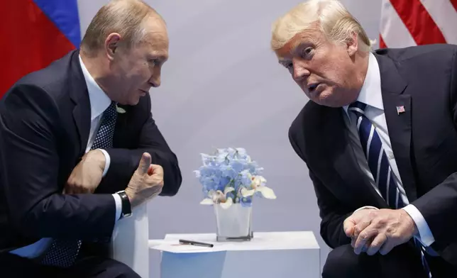 FILE - President Donald Trump, right, meets with Russian President Vladimir Putin at the G-20 Summit in Hamburg, July 7, 2017. (AP Photo/Evan Vucci, File)